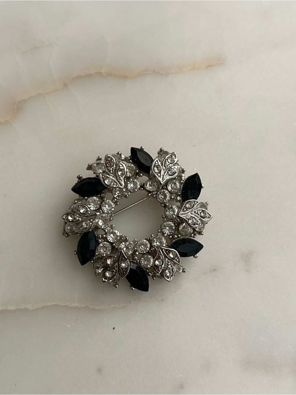 Silver-Tone Wreath Brooch with Black and Clear Stones